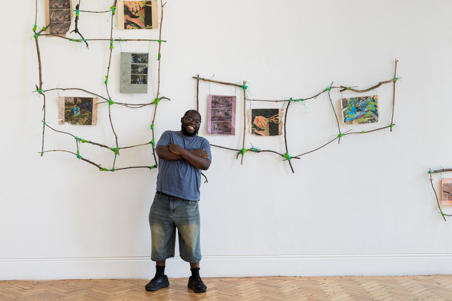 Immanuel stands in front of the installation at Camden Art Centre.
