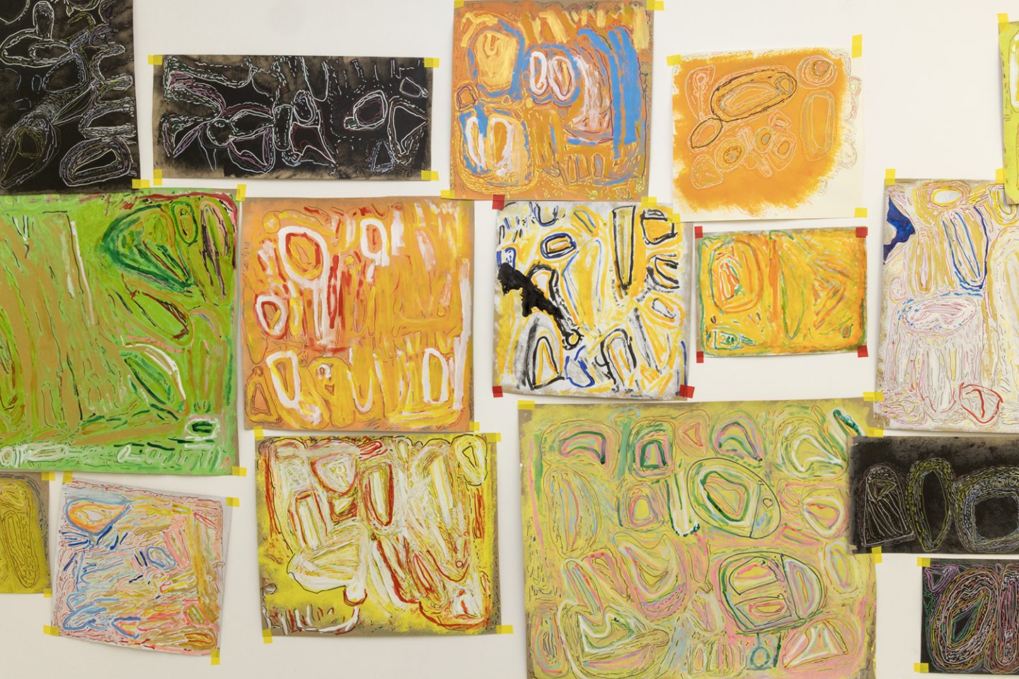 A wall coverted in drawings by Chandrakant Patel in a variety of different sized rectangles and squares