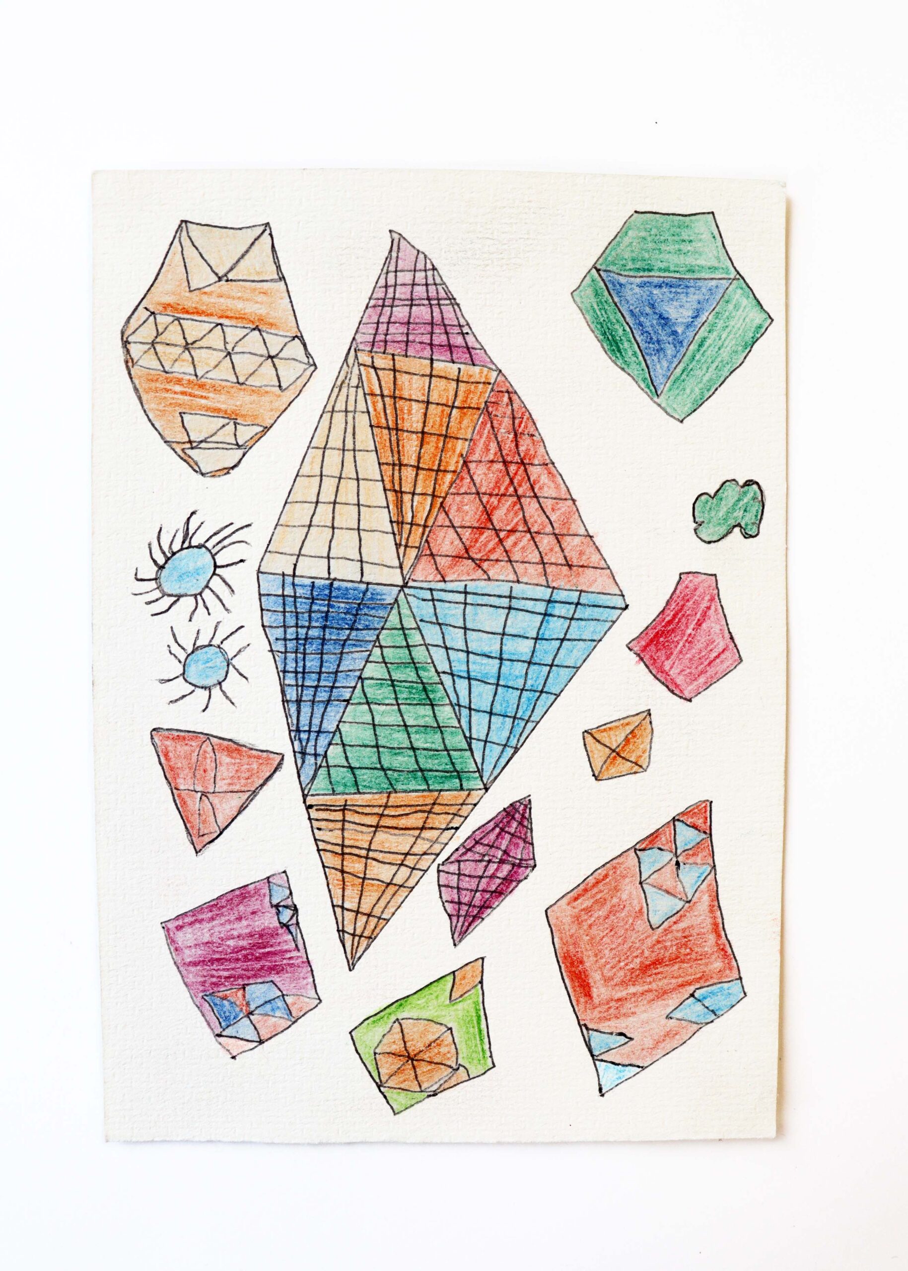 A small colourful, pencil drawing on paper with angular shapes and grid like hatching marks.