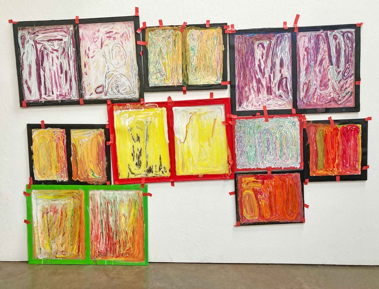 Wall collage of framed paintings on acetate, 2024. Image courtesy of the Artist and ActionSpace.