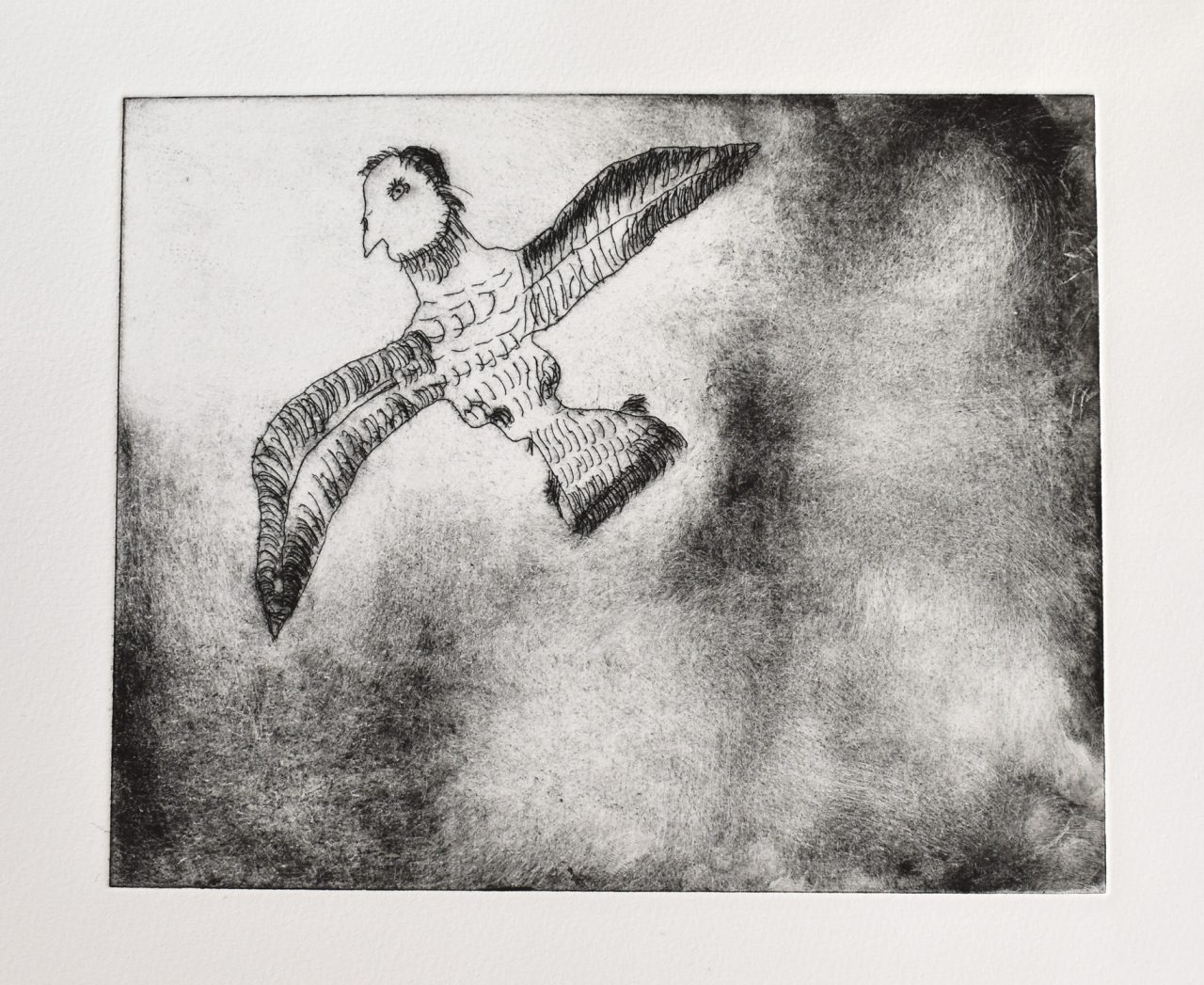 A black intaglio print of a bird with a man's head on white paper.