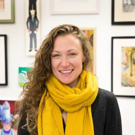 A picture of Beth Elliott. Beth is a white woman with long, brown hair. She is wearing a yellow scarf.