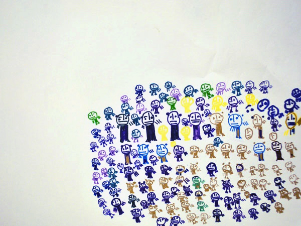 A group of small figures arranged in a grid formation forming a square to the bottom right of the paper.