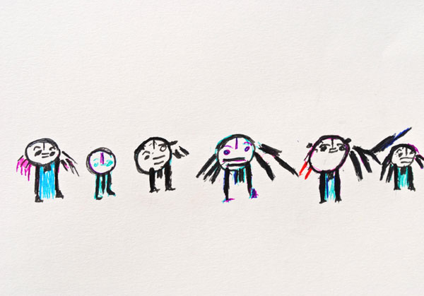A line up of six small figures standing in a lin
