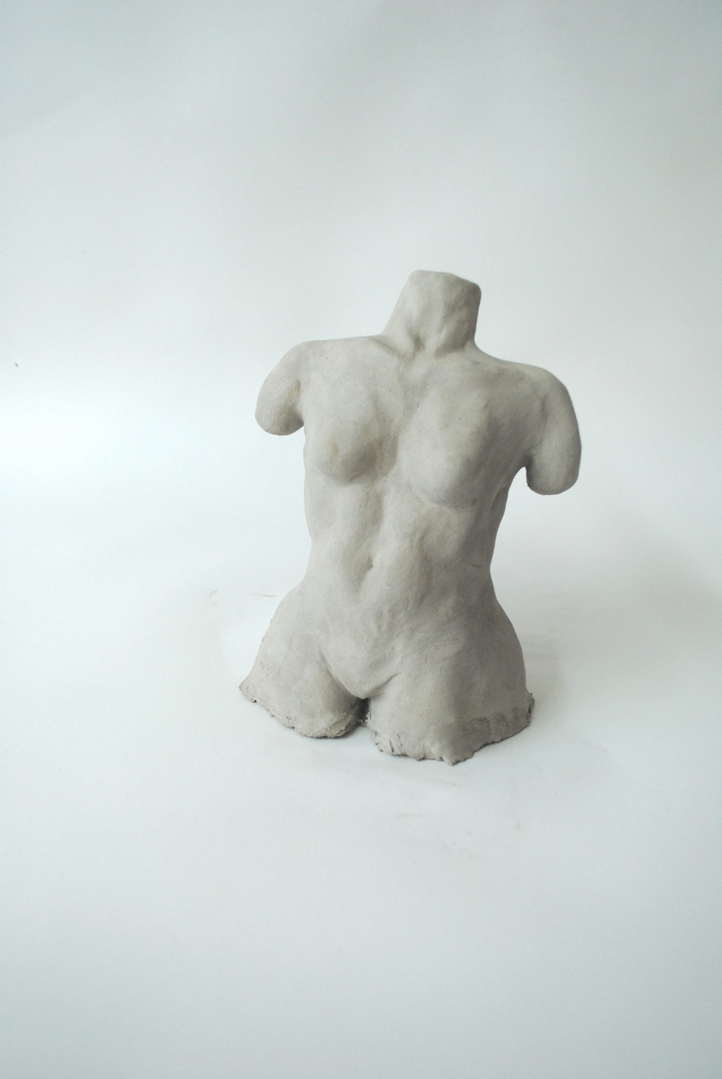 A sculpture of a nude female form.