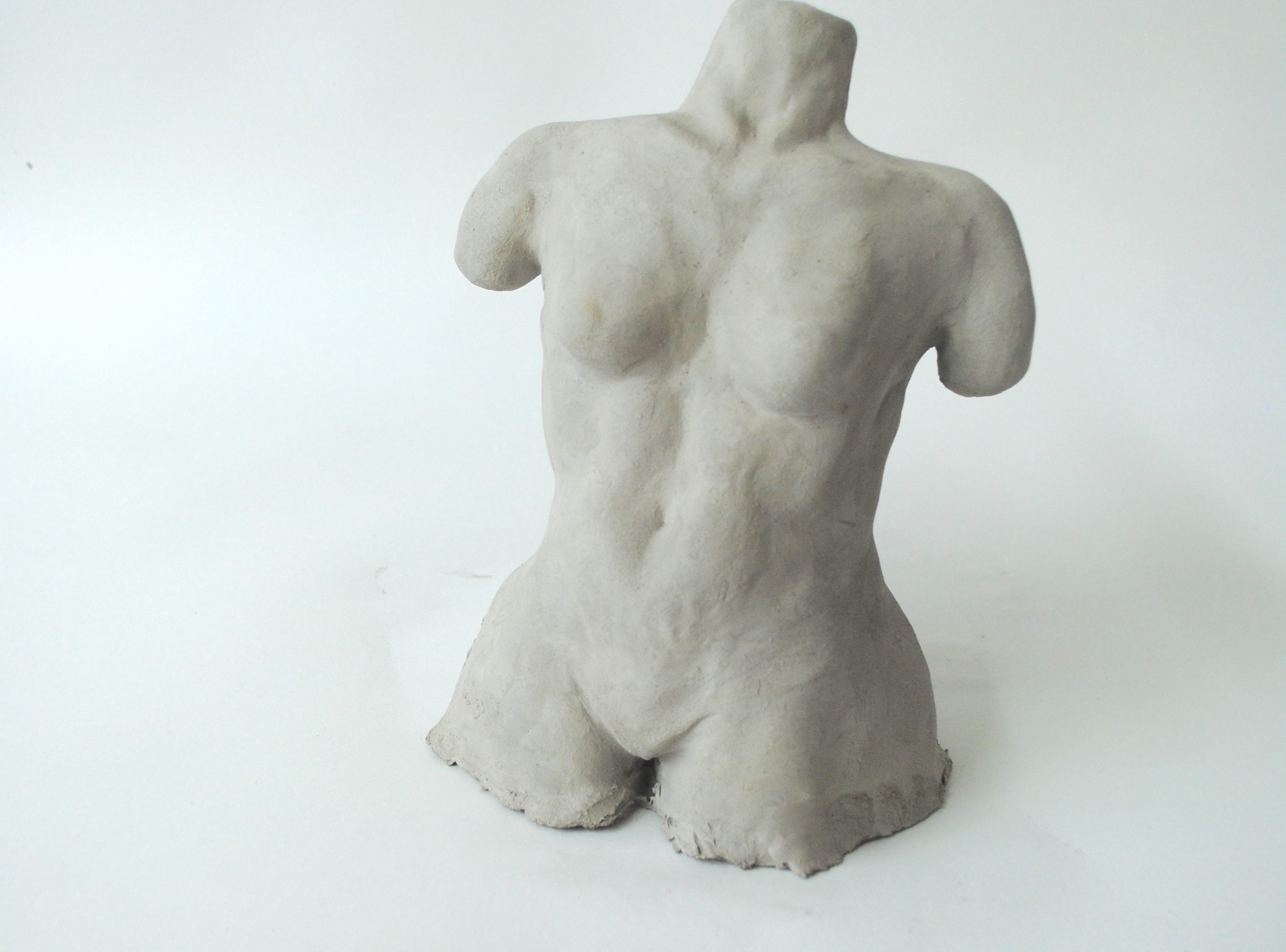 A sculpture of a nude female form.
