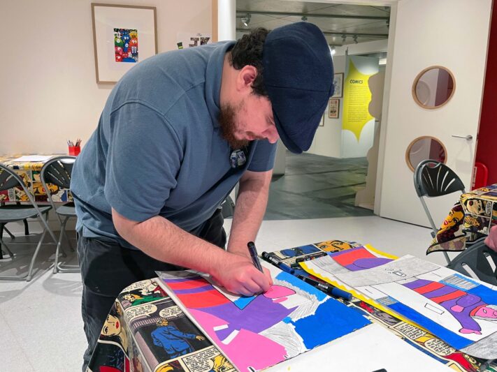 Evan Bond making his artwork.