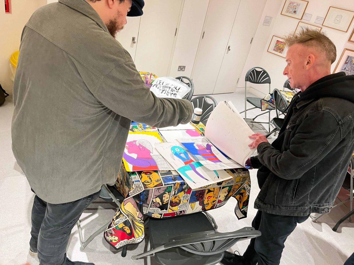 Evan Bond with his artwork. Image courtesy of ActionSpace and the Artist.