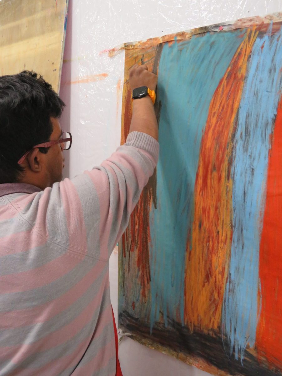 Mohammed Imran Khan making his artwork.