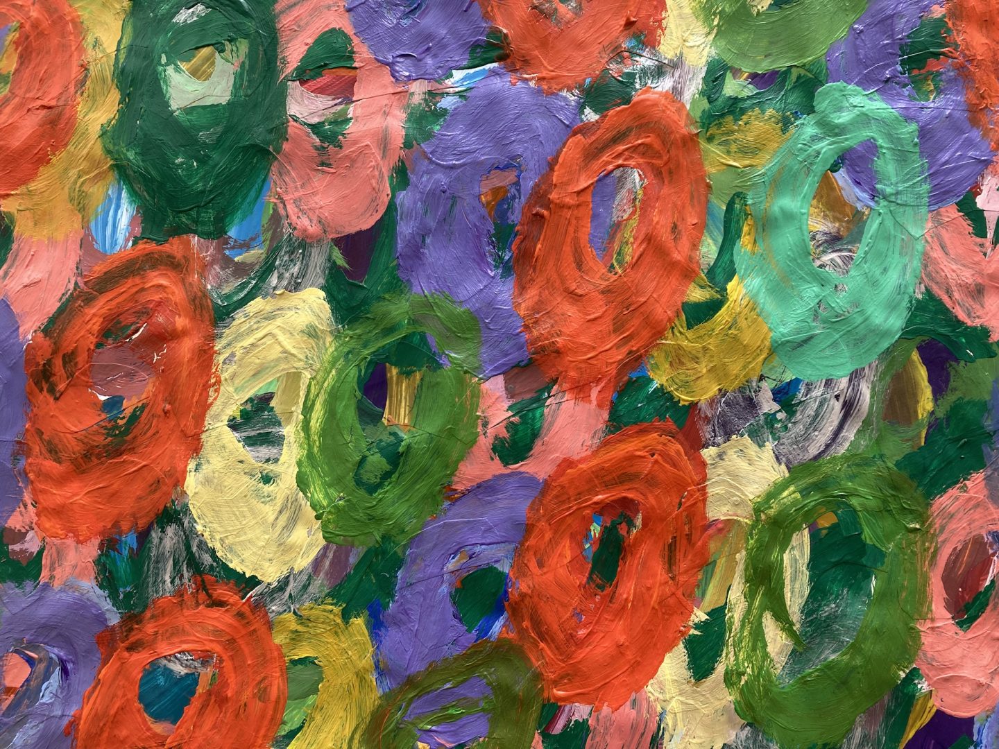 Detail of abstract painting by Kwaga Sillingi. The painting is of layered multi coloured circles.