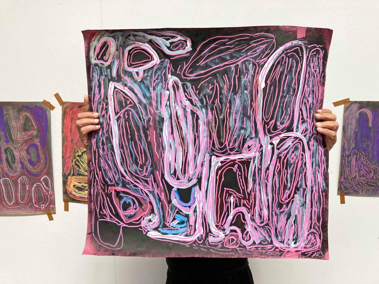 Chandrakant Patel holding artwork, 2025. Image courtesy of the Artist and ActionSpace.