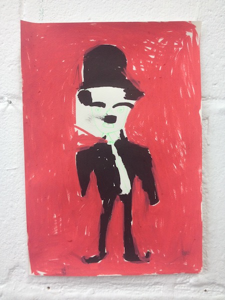 A drawing of a figure wearing a black hat, against a red background.