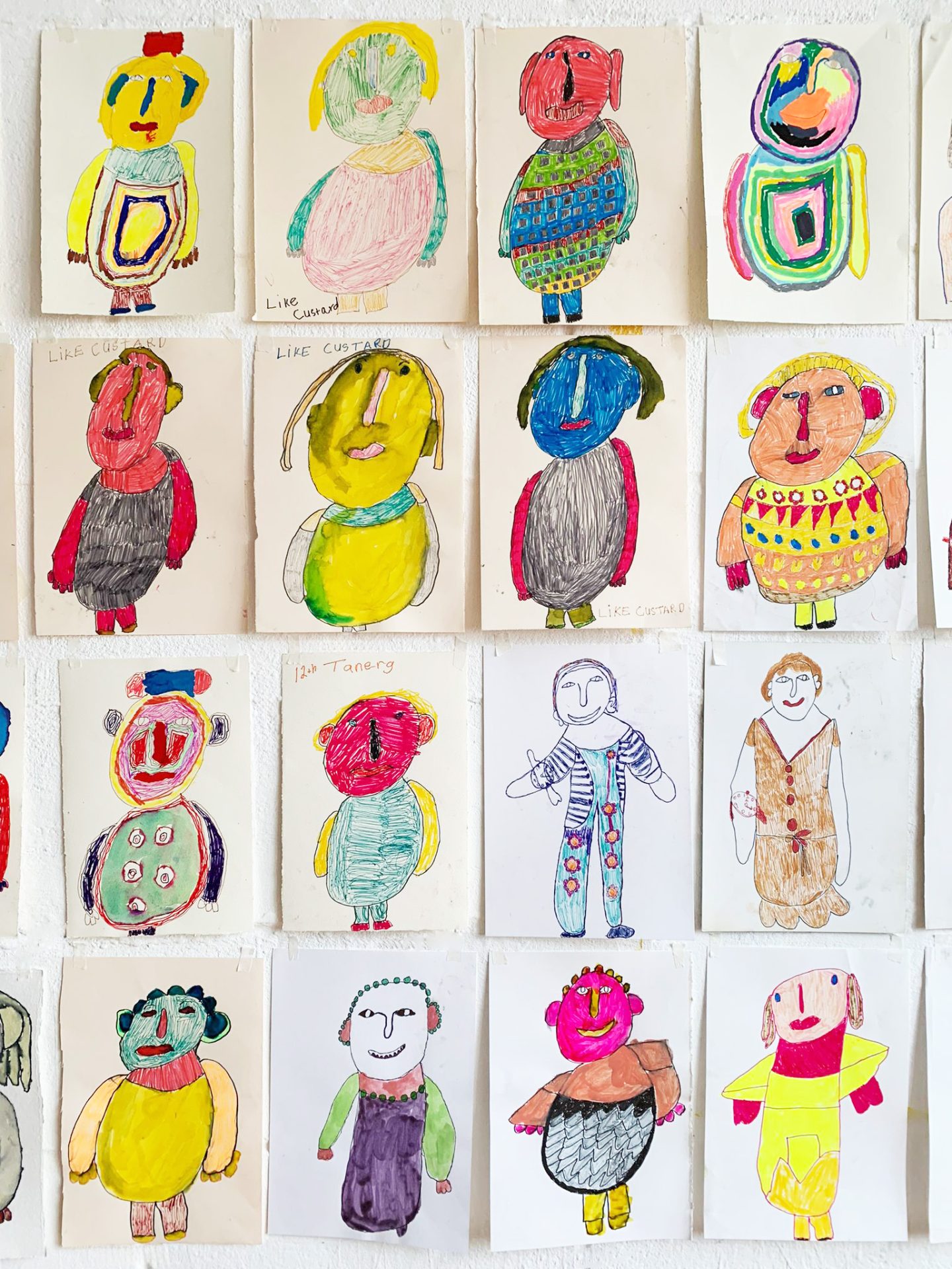 A collage of colourful portraits in pen on paper.