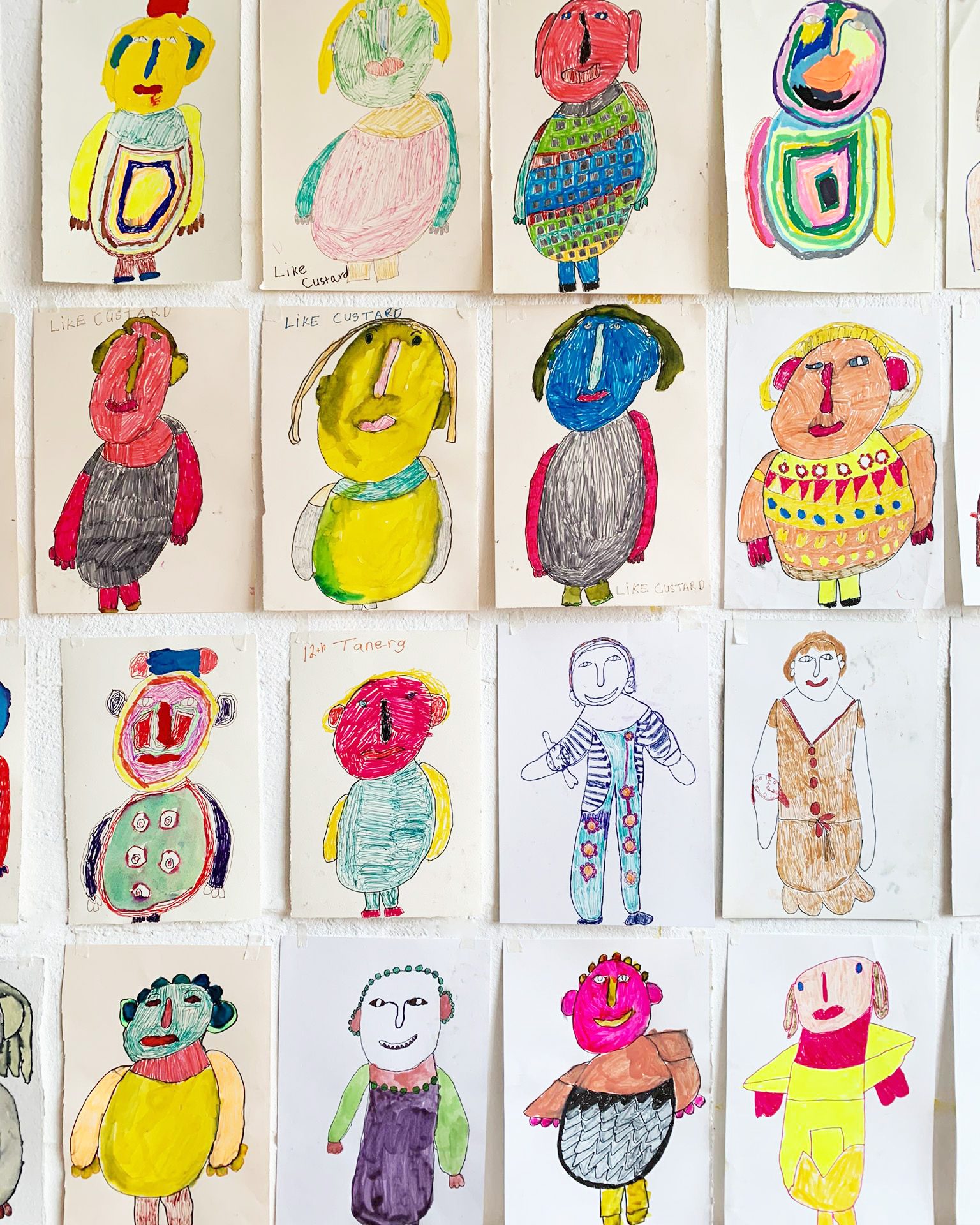 A collage of colourful portraits in pen on paper.