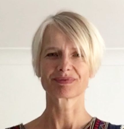 A picture of Lisa Muten. Lisa is a white lady with short blonde hair, she is wearing a patterned top.