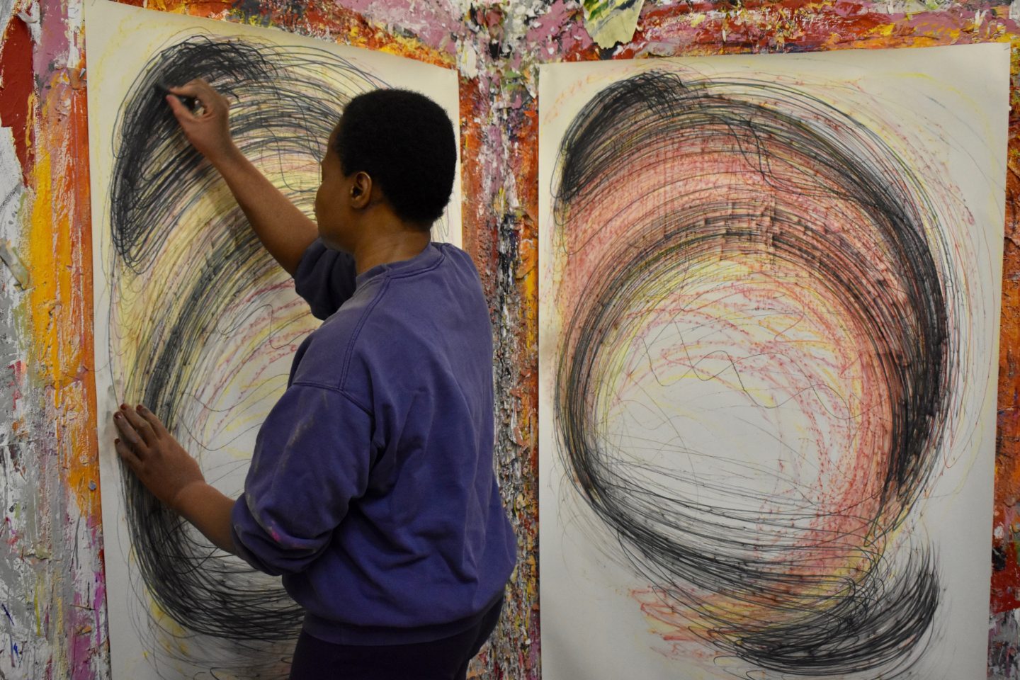 Nnena Kalu working on one of her large drawings.