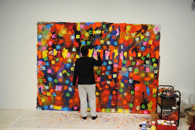 Artist Mary Ogunleye working on an artwork.