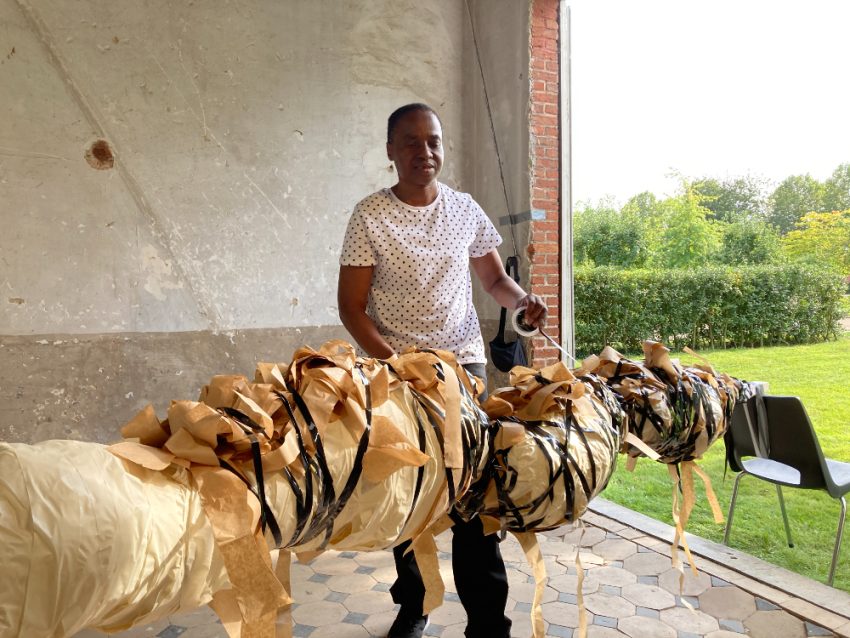 Nnena Kalu with her artwork. Image courtesy of ActionSpace. 