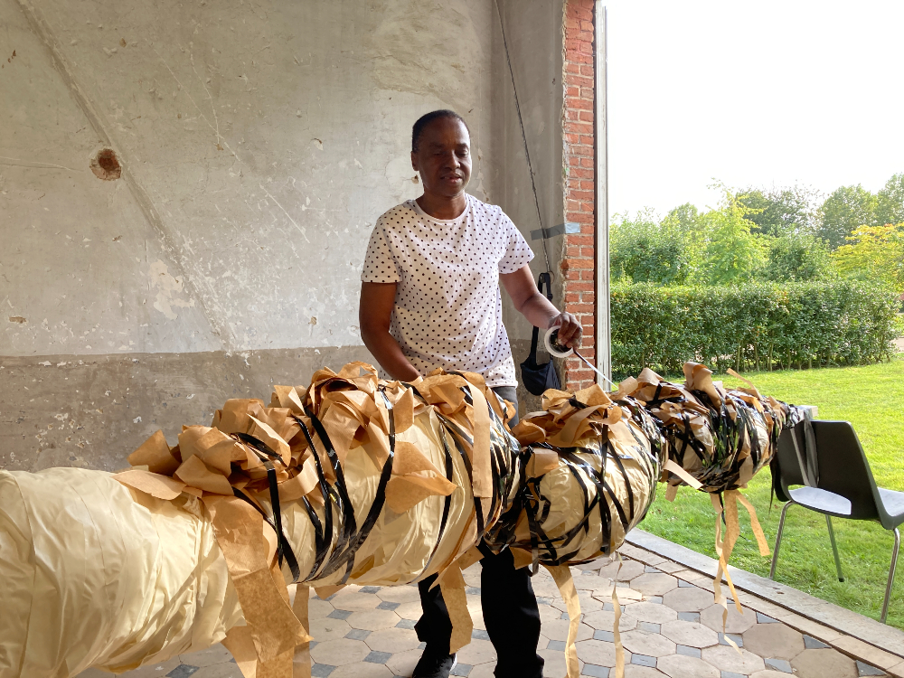 Nnena Kalu with her artwork. Image courtesy of ActionSpace. 