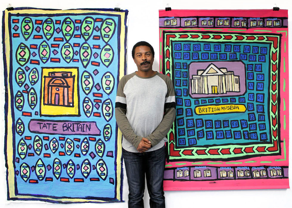Artist Thompson Hall stood between his paintings of Tate Britain and the British Museum.
