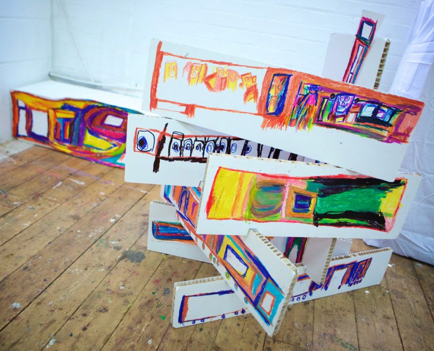 Tim's artwork: strips of rectangular white foamboard, assembled together in a sculptural form. Each rectangle has Tim's abstract illustrations drawn on in marker pen.