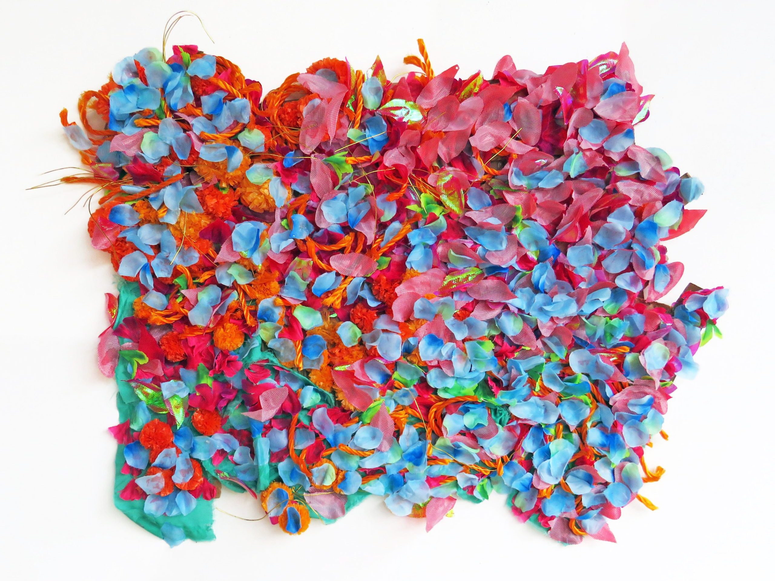 Ajanthan Jeevan's artwork, a textural, colourful piece with different fabrics and materials stuck to an A4 size board.