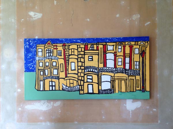 A bright coloured block painting of a building.