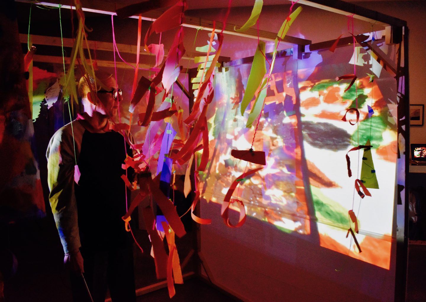 Artist Mark Lawrence stood beside his projection installation at Autograph Gallery.