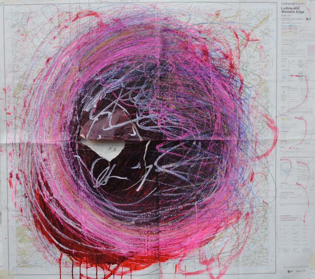 a ripped piece of paper with a pink and red painted swirl in its centre. It is Nnena Kalu's artwork.