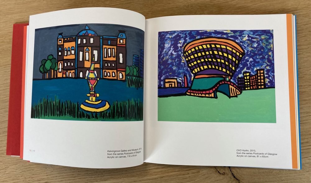 A book open on pages with paintings depicting buildings.