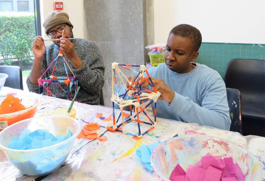 Participants make artwork in the style of Abubakar. Image courtesy of ActionSpace.