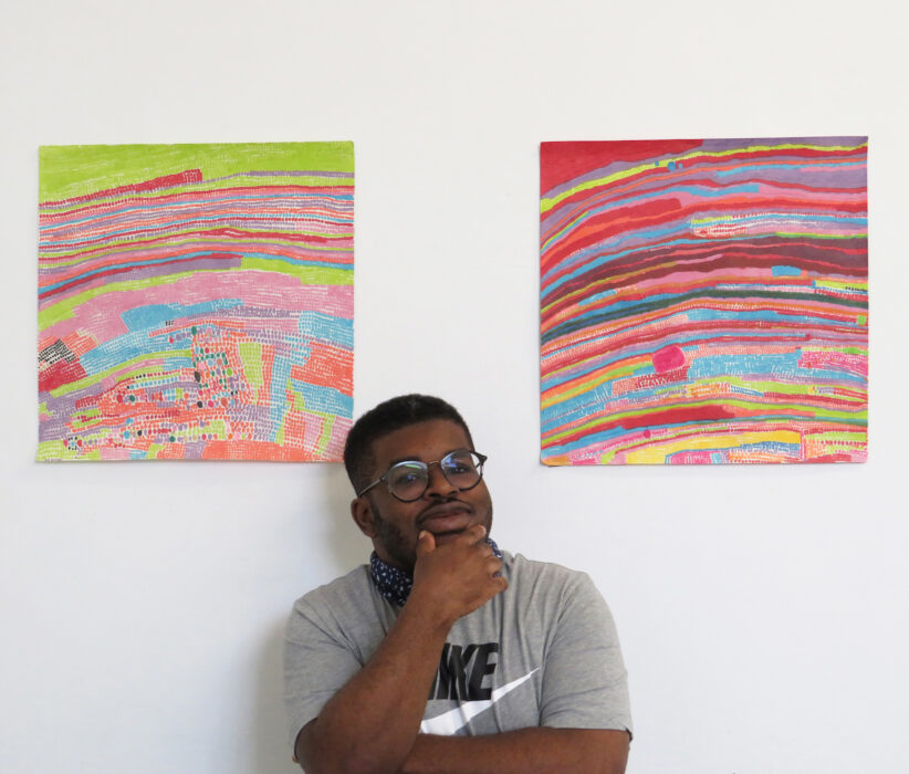 Jorrel Bonnick and his artwork. Image courtesy of ActionSpace.