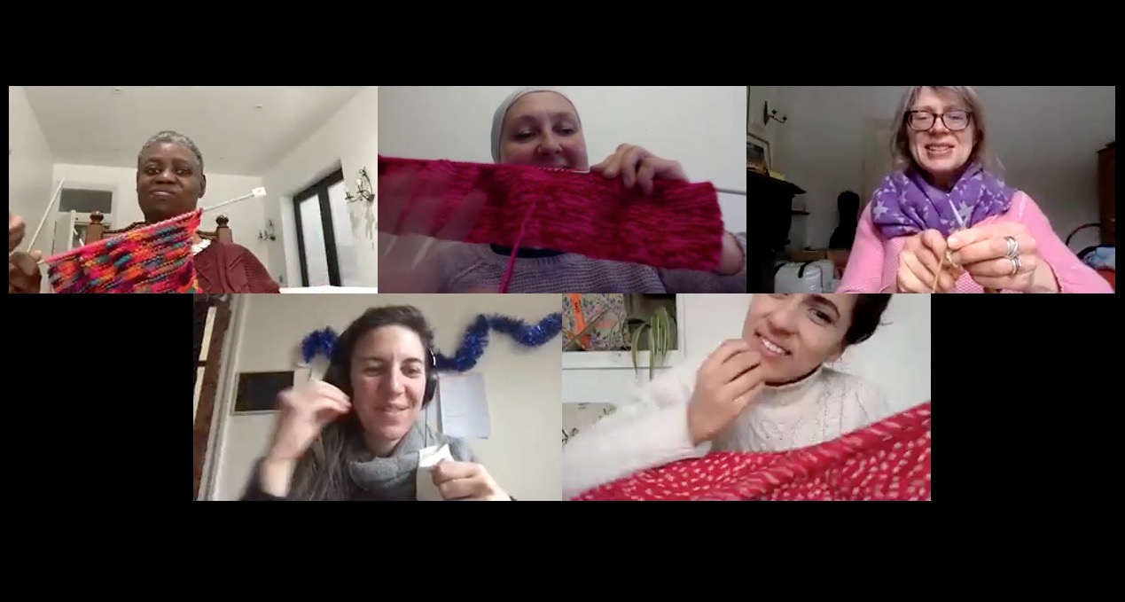 Zoom image of five people holding up their knitting and sewing.