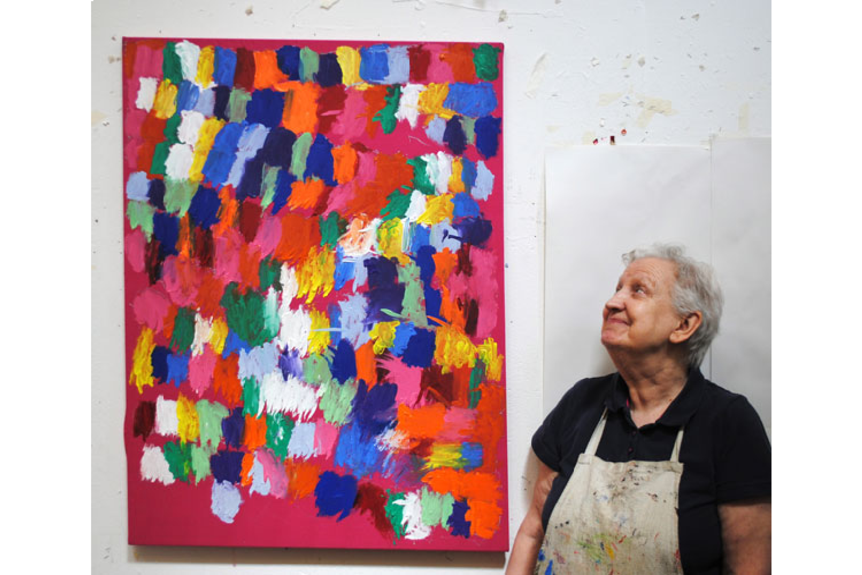 Artist Connie Moth-Price stood next to one of her abstract paintings.
