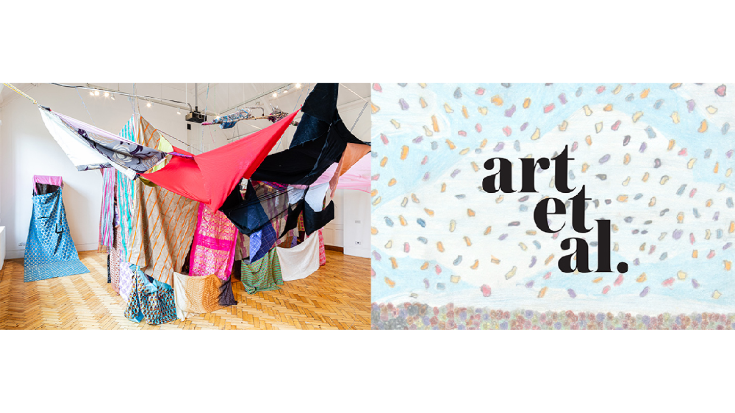 An installation of suspended fabric and objects.