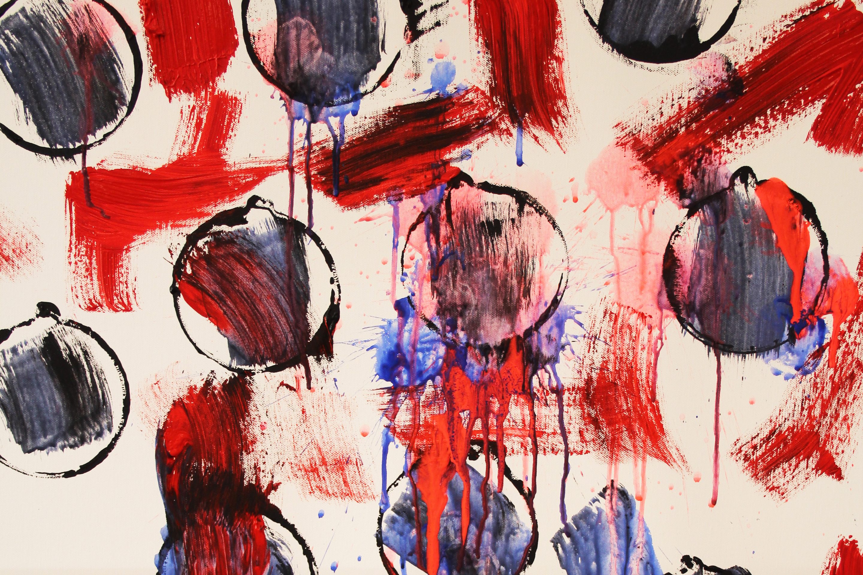 An ink painting, showing black circles with red, black and blue streaky paint in and around them.