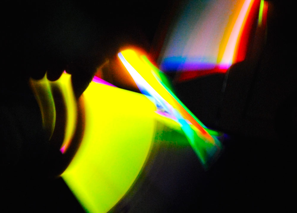 a stream of light in the dark, made visible from the slow shutter speed of the camera.